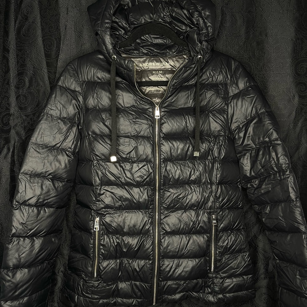 Andrew Marc, black puffer jacket with hood and inside pockets. Size medium